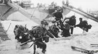 D-Day landing - troops getting off boats in France