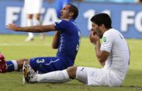 Italy's Giorgio Chiellini (left) claims he was bitten by Uruguay's Luis Suarez, who holds his teeth