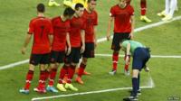 Referee puts down spray