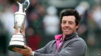 Northern Ireland's Rory McIlroy holds up the Claret Jug