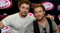 Aaron Taylor-Johnson (Quicksilver) with Chris Hemsworth (Thor)