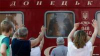 People wave off friends a relatives on a train from Donetsk to Moscow, 2 August 2014