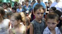 Women and children shelter near Mariupol, in the government-controlled south of Donetsk region