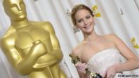 Jennifer Lawrence holding her Oscar