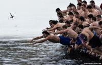 Bulgarians dive into the icy waters in Sofia as part of Epiphany Day celebrations
