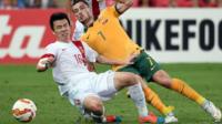 China's Sun Ke and Australia's Mathew Leckie fight for the ball during the quarter-final football match between Australia and China at the AFC Asian Cup in Brisbane on 22 January, 2015