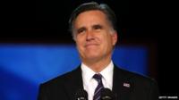 Mitt Romney, speaks at the podium as he concedes the presidency during Mitt Romney's campaign election night event at the Boston Convention 7 November 2012
