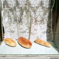 Krakow, Poland, 1988, Three loaves of bread. Photograph by © David Hlynsky