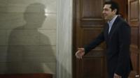 Greek Prime Minister Alexis Tsipras welcomes Eurogroup President Jeroen Dijsselbloem (not pictured) during their meeting in Athens on 30 January 2015