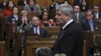 Canada's Prime Minister Stephen Harper speaks in the House of Commons on Parliament Hill in Ottawa 24 March 2015