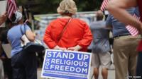 A woman protests at religious freedom rally in Chicago, Illinois