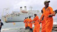 Workers haul part of a fibre optic cable onto the shore at the Kenyan port town of Mombasa in 2009, bringing internet connectivity from the United Arab Emirates