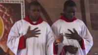 Nigerians attend Palm Sunday service and pray for peace around the outcome of presidential elections at a church service in the oil rich Niger Delta