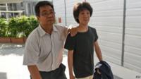 Amos Yee arrives at court with his father in Singapore (31 March 2015)