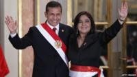 Peruvian President Ollanta Humala (left) waves with Prime Minister Ana Jara during her swearing-in ceremony in Lima on 22 July, 2014
