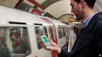 Man using EE on London Underground