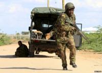 Kenya Defence Force soldier runs for cover at Garissa campus, 2 Apr 15