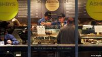 Workers are viewed in a restaurant in Manhattan on 6 March 2015 in New York City