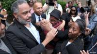 Anthony Ray Hinton is greeted by family outside the Jefferson County Jail in Birmingham, Alabama