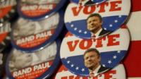 Campaign buttons with Rand Paul's face