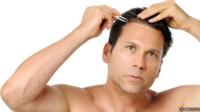 Man plucking hair