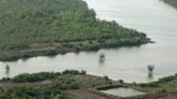 An oil well head is seen at mangrove swamps near Port Harcourt Nigeria - archive