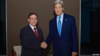 US Secretary of State John Kerry (R) shakes hands with Cuban Foreign Minister Bruno Rodriguez in Panama City