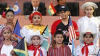 Children representing the native dress of North and South American countries perform during the inauguration ceremony of the Summit of the Americas in Panama City on 10 April 2015