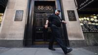 Security guard exits the Hatton Garden Safe Deposit Ltd on Tuesday, the day the robbery was revealed