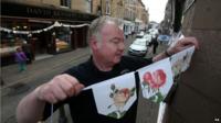 Graham Fleming puts up bunting in Dunblane