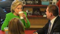 Hillary Clinton has coffee with local residents at the Jones Street Java House during a campaign visit April 14, 2015 in Le Claire, Iowa.