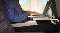 A generic picture of a laptop being used on a plane