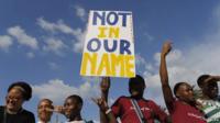 Some of the thousands of people are seen carrying anti xenophobia posters during a mass march calling for an end to attacks against foreign nationals, Johannesburg, South Africa, 23 April 2015.