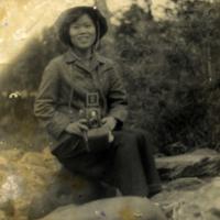 Quy holding a camera
