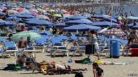 A Benidorm beach busy with tourists