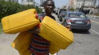 Man with jerry cans