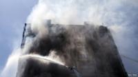 Smoke rises from a tall apartment building on fire in Baku, Azerbaijan