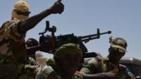 Nigerien soldiers patrol in Bosso, near the Nigerian border, on 25 May 2015