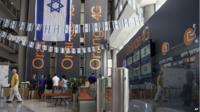 Israeli flags are seen inside the "Partner Orange" Communications Company offices in the city of Rosh Haain, Israel, Thursday, June 4, 2015.