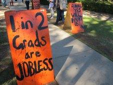 Sign on Florida campus saying '1 in 2 grads are jobless'