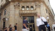 People walk past an HSBC branch in Buenos Aires, Argentina