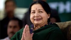 AIADMK leader Jayaram Jayalalitha greets the audience during her swearing-in-ceremony as the Chief Minister of Tamil Nadu state in Chennai