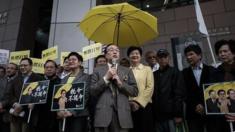 Pro-democracy legislator Alan Leong says a few words to the media outside the Wanchai police station in Hong Kong on March 2, 2015