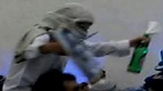Frame from video showing man apparently dancing holding a knife and firebomb, at a wedding celebration shown on Israel's Channel 10 television