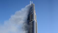 Smoke billows from the Address Dowtown Hotel in Dubai, on 1 January, 2016