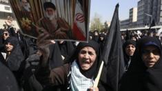 Iranian woman carries poster of Ayatollah Ali Khamenei at anti-Saudi rally in Tehran - 25 September