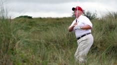 JULY 10: Donald Trump plays a round of golf after the opening of The Trump International Golf Links Course on July 10, 2012 in Balmedie, Scotland