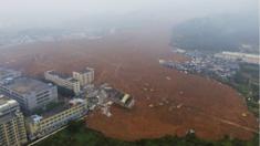 In this photo taken from a drone mounted camera, rescue workers search for survivors in the aftermath of a landslide in Shenzhen in southern China's Guangdong province Monday, 21 December 2015.