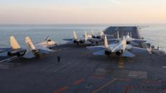 Chinese J-15 fighter jets on the deck of the Liaoning aircraft carrier during military drills in the Bohai Sea, off China