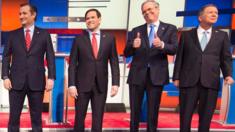 Jeb Bush, Ted Cruz, Marco Rubio and John Kasich stand on stage before a Republican debate in Iowa.
